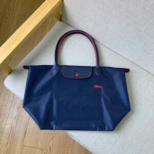 Longchamp Navy Crossbody Bag with Red Accents